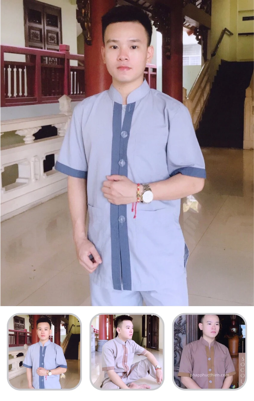 phap-phuc-tu-phoi-kate Man in a light gray traditional tunic posing indoors, hands clasped, wearing a watch and bracelets.