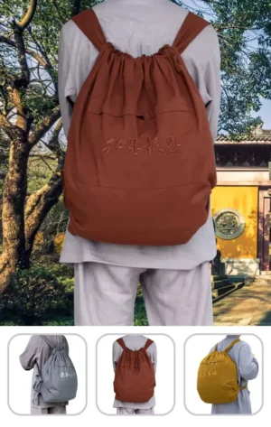 Pháp Phục Back view of a rust colored drawstring backpack worn by a person in a park with trees in the background