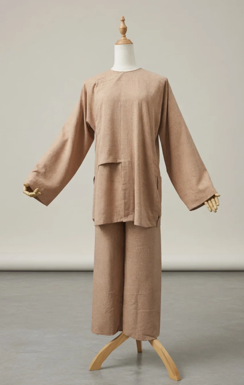 Beige loose-fit tunic with wide sleeves and matching wide-leg pants on a dress form.