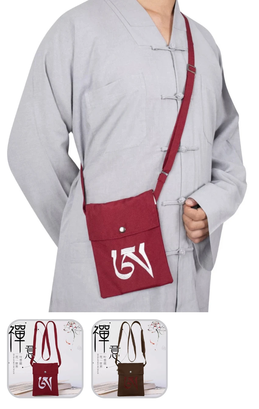Person wearing a light gray traditional tunic with a red crossbody bag featuring a white logo over the chest area