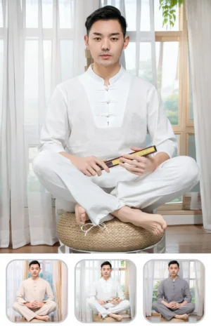 Asian man in a white traditional outfit sits cross‑legged on a woven cushion, holding a wooden scroll in a bright room with sheer curtains.