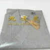 Folded light gray blazer with a gold brand logo and tag reading 'JIULIANHUA' attached to the fabric.